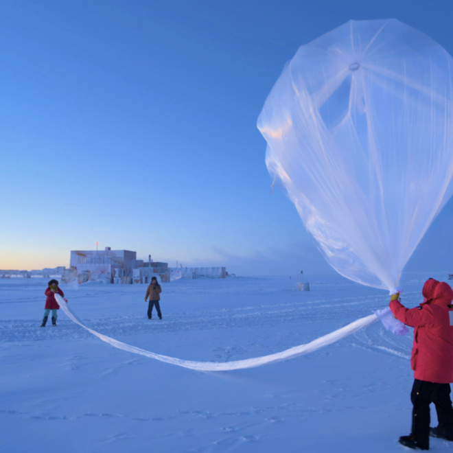 NOAA scientists launch a weather balloon carrying an ozonesonde at the South Pole on October 1, 2023. (Image credit: Marc Jaquart/IceCube)